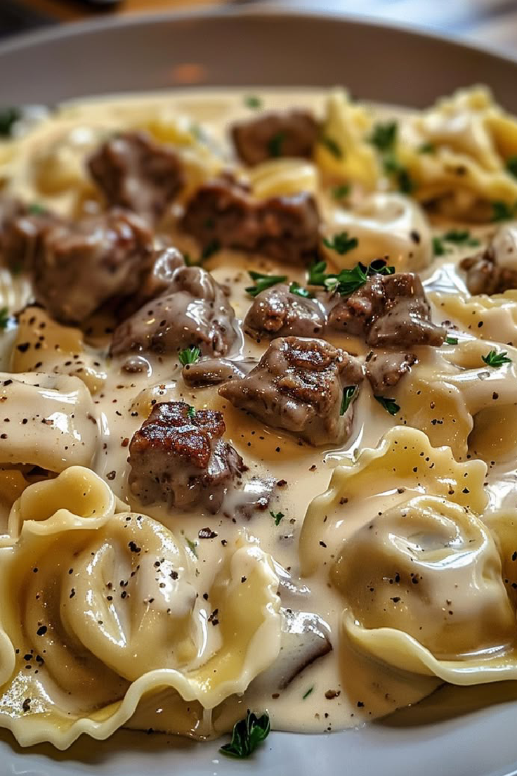 Cheesesteak Tortellini in Creamy Provolone Sauce 25 Savory Cheesesteak Tortellini in Creamy Provolone Sauce